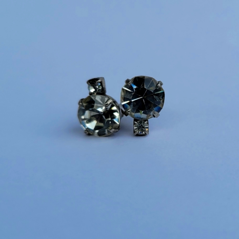 Two diamond stud earrings